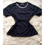 black tee with neck chain